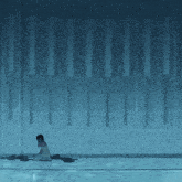 a person laying on the floor in front of a wall with a row of lines