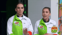 two women wearing green and white jackets with hoy chef on them
