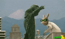 a frog and a rabbit are dancing on a rooftop with a green background that says cartoon
