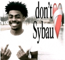 a man in a white shirt giving the middle finger with the words do n't sybau behind him