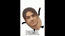 a man 's head is sitting on top of a potato with the word pablo written on it .
