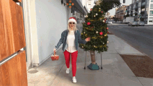 Waving Human Christmas Tree GIF - Waving Human Christmas Tree Candy Canes GIFs