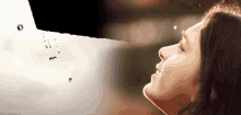 a picture of a woman 's face with the name aye masakami on the bottom