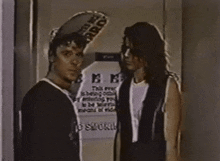 two men are standing in front of a sign that says " limited rice "