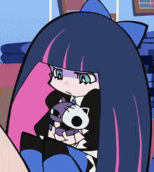 a cartoon character is holding a stuffed animal and the word animeko is on the bottom right