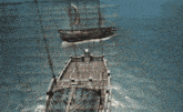 a pirate ship is on fire in the middle of a storm