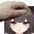 a close up of a person 's hand touching a girl 's head .