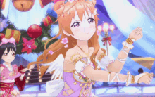 two anime girls are dancing in front of a christmas tree with bells