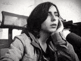 a black and white photo of a woman with a gifs watermark