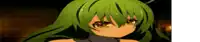 a close up of a green haired anime girl 's face in a dark room .