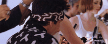 a man wearing a black and white bandana with the words zoolander2 on the bottom