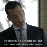 a man in a suit and tie is saying sorry you felt humiliated
