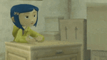 coraline from coraline the animated movie is sitting on a wooden table .