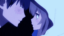 a boy and a girl are kissing in a dark room