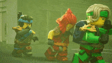 a group of lego figures are standing next to each other in a room