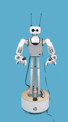 a robot with a striped shirt and antennas