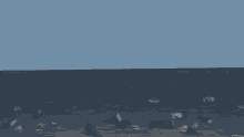 a bunch of pieces of paper are flying in the air with a blue sky in the background