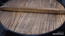 a wooden tray with the words made in animotica written on it