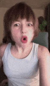 a young girl making a funny face with her mouth open