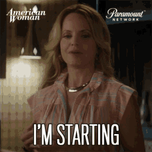 a woman says i 'm starting in front of an american woman logo