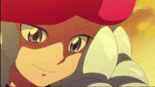 a close up of a cartoon character 's face with a tv channel in the background