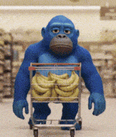 a blue monkey is pushing a shopping cart full of bananas