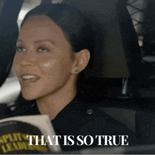 a woman in a police uniform is sitting in a car with the words that is so true above her