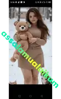 a woman holding a teddy bear with the words assalamualaikum written below her