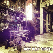 a man laying on the ground under a bench with the words just play sucks on the bottom