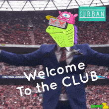 a man in a suit and tie with a green monster head says welcome to the club