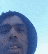 a close up of a man 's face with his mouth open