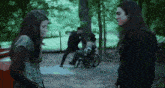 a man in a wheelchair is being pushed by another man