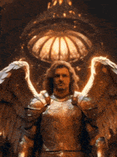 a man in armor with wings stands in front of a dome