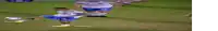a blurry picture of a soccer game with a player wearing a jersey that says ' a ' on it