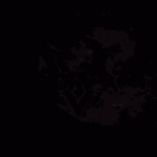 a blue and white glowing object is against a dark background