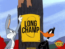 bugs bunny and daffy duck from looney tunes are standing next to a sign that says long champ