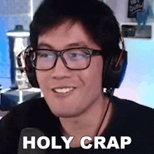 a man wearing glasses and headphones has the words holy crap written on his face