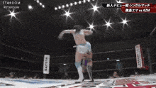a woman is wrestling another woman in a ring .