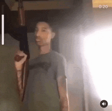 a video of a man holding a gun with the time 4:20
