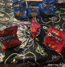 several bags of doritos are sitting on a table
