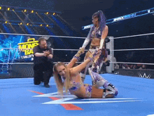 two women wrestling in a ring with a sign that says money in the bank valley