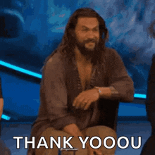 a man with a beard is saying thank you