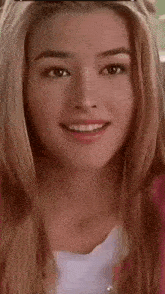 a close up of a woman 's face with a heart in the middle