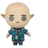a stuffed toy with a bald head and ears has a serious look on his face