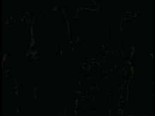 a group of young women standing next to each other in a dark room