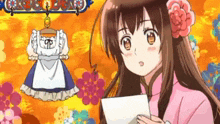 a girl in a pink dress is holding a piece of paper in front of a dress hanging on a hanger .