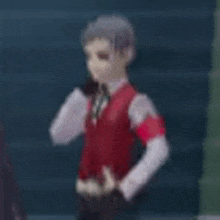 a blurry picture of a person wearing a red vest and a white shirt .