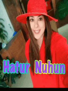 a woman wearing a red hat and a red shirt with the name hatur nuhun