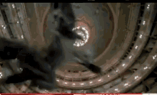 an aerial view of a building with a circle in the middle of it .