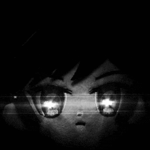 a black and white image of a person 's eyes